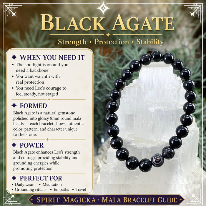Black agate bead bracelet with one banded bead, on a selenite tower