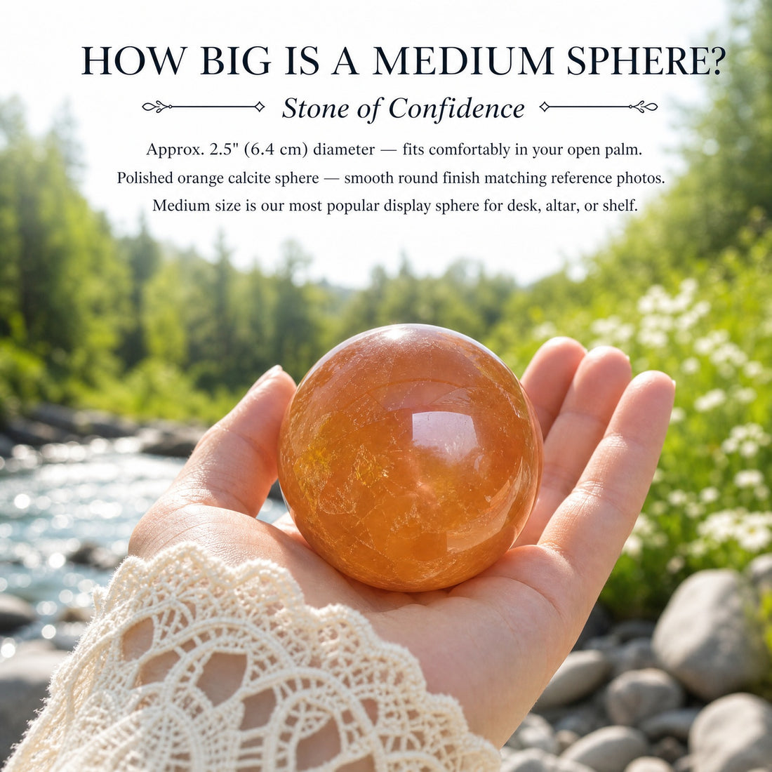 One medium orange calcite sphere resting in an open palm beside a forest stream, showing its size against the hand