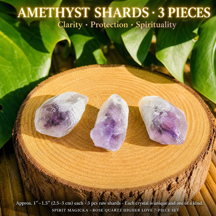 Three raw amethyst shards in lavender and deep purple on a wood slice