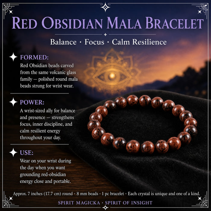 A bracelet of polished round red obsidian beads with black markings resting on black velvet