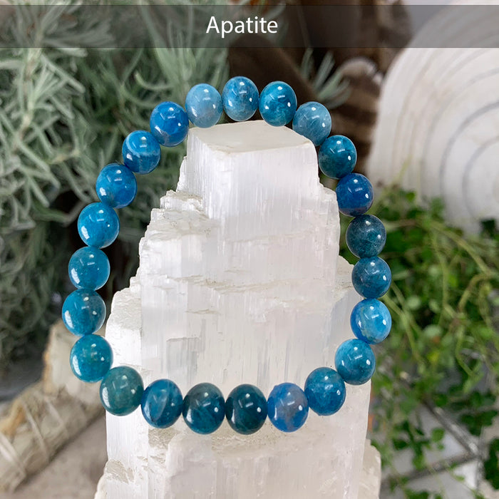 Blue apatite bead bracelet on a selenite tower