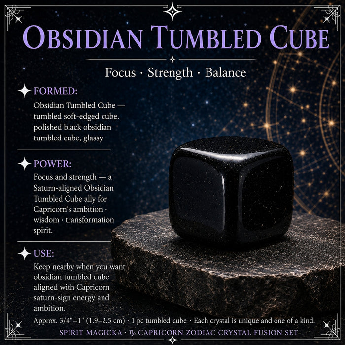 A soft-edged polished black obsidian cube on a dark stone slab