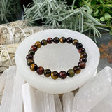 Mala Multicolor Tiger's Eye armbånd med fløjlpose