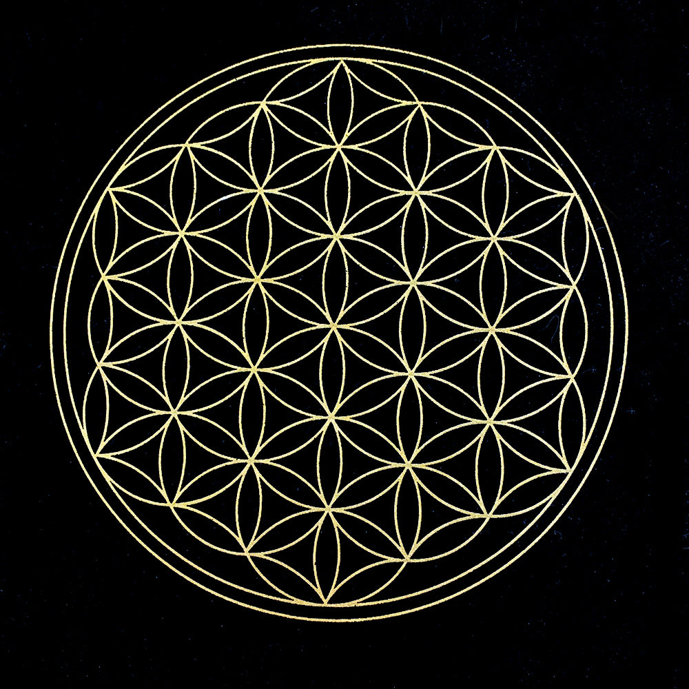 A gold Flower of Life pattern of overlapping circles printed on black velvet